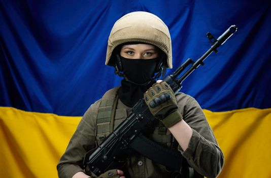 a girl Ukrainian soldier on the background of the flag of Ukraine, wearing a helmet and a bulletproof vest
