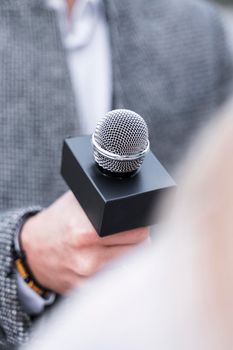 close up journalism microphone