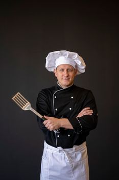 medium shot chef posing with spatula