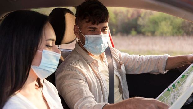 close up couple wearing medical masks