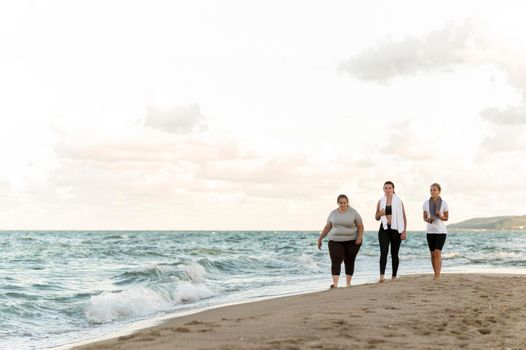 long shot fitness friends walking shore