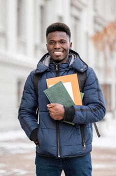 portrait male student with books