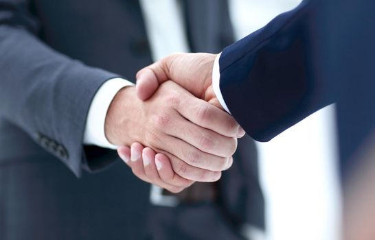 Close-up view of the hands of a businessman in the office in the formal wear.