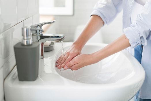 side view woman using water wash her hands