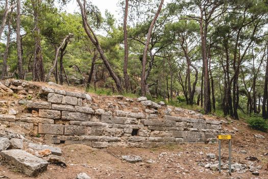 Ruins of Tapinak temple of ancient Phaselis city. Famous architectural landmark, Kemer district, Turkey.
