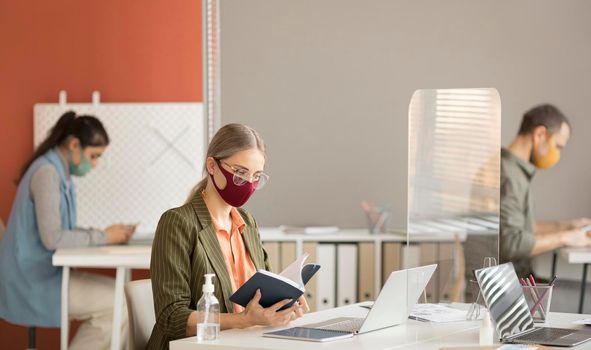 co workers wearing face mask work