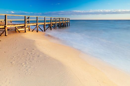 Piers near Millionaire's Walk at Point King Beach on a cool winter's morning at sunrise on the Mornington Peninsula in Sorrento, Victoria, Australia