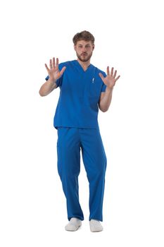 Young male medical nurse healthcare worker showing stop sign isolated on white background full length studio portrait