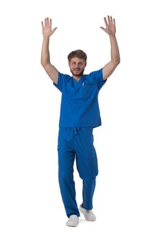Young male medical nurse healthcare worker with raised arms isolated on white background full length studio portrait