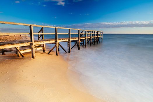 Piers near Millionaire's Walk at Point King Beach on a cool winter's morning at sunrise on the Mornington Peninsula in Sorrento, Victoria, Australia