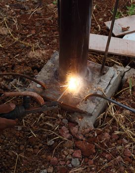 worker us electric welding connecting construction metal 