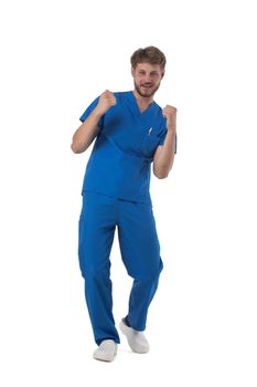 Young male medical nurse healthcare worker holding fists isolated on white background full length studio portrait