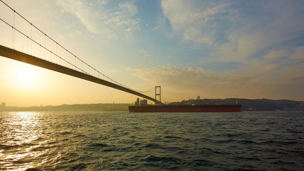 Turkey, Istanbul, Bosphorus Channel, Bosphorus Bridge, an cargo ship under the Bridge