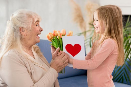 grandma with flowers from little girl