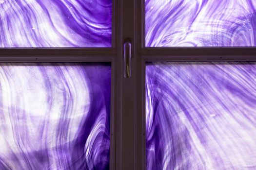 Purple painted glass in a window