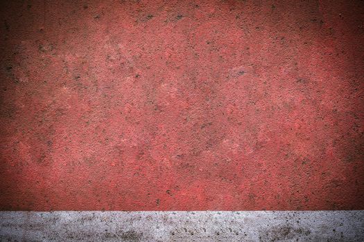 Red concrete background with a white line