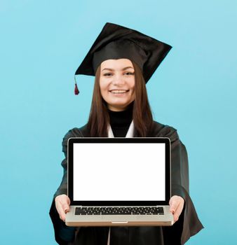 front view girl holding laptop