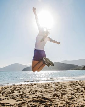 happy young woman jumping