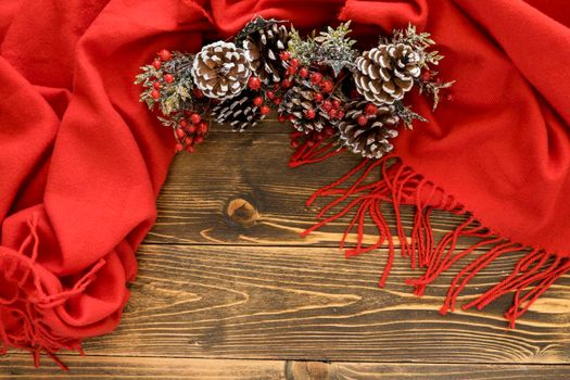 flat lay cute winter pine cones red scarf