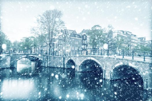 View of Amsterdam canal with snow, Netherlands