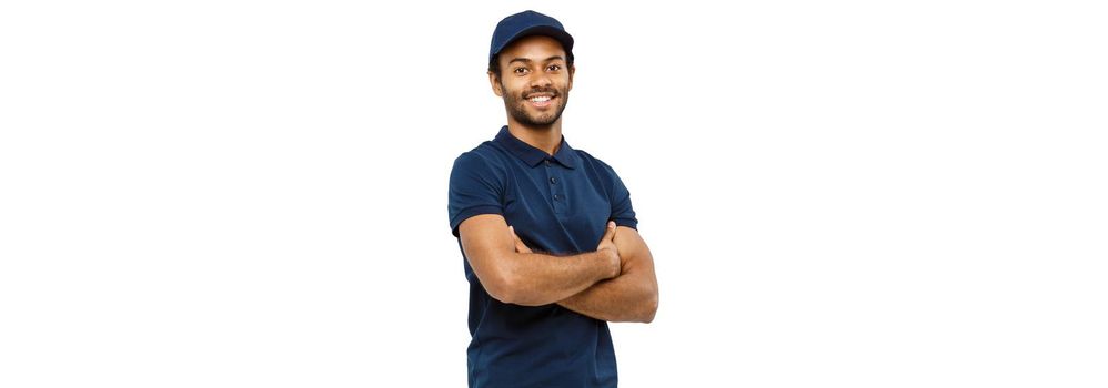 Delivery Concept - Handsome African American delivery man crossed arms over isolated on Grey studio Background. Copy Space