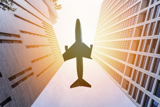 Airplane flying over two skyscrapers: 3D illustration