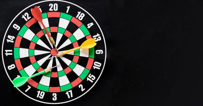 flat lay darts table black background with copy space