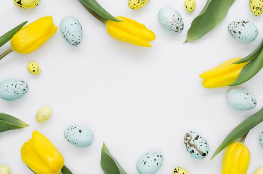 flat lay eggs easter with tulips frame
