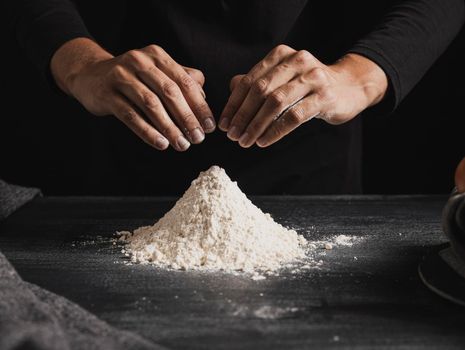 front view baker hands mixing flour