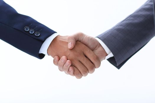 Close-up partial view of two businessmen shaking hands, business concept