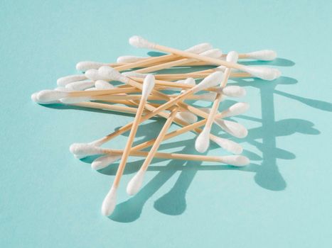 arrangement with cotton buds blue background