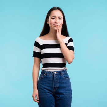 young woman with tooth pain