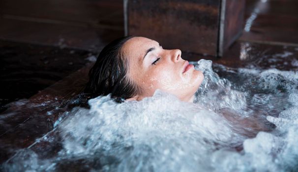 woman relaxing whirlpool