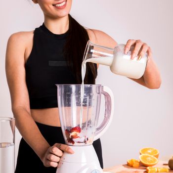 fitness woman preparing detox juice