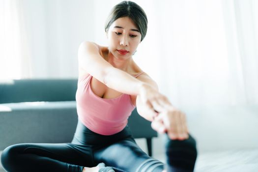 stress relief, muscle relaxation, breathing exercises, exercise, meditation, portrait of Young Asian woman relaxing her body from office work by practicing yoga by watching online tutorials