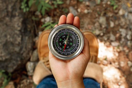 top view female using compass directions