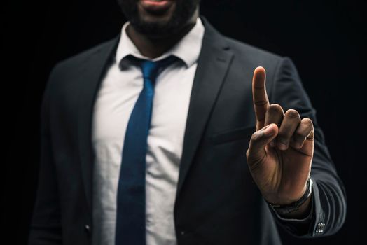 ethnic businessman pointing up