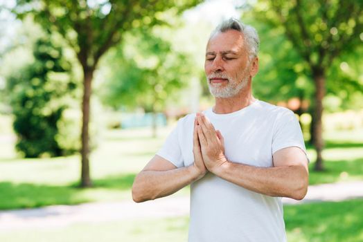 side view man with hands meditating position