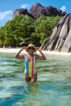 Anse Source d'Argent beach, La Digue Island, Seyshelles, La Digue Seychelles tropical Island, young Asian woman on the beach