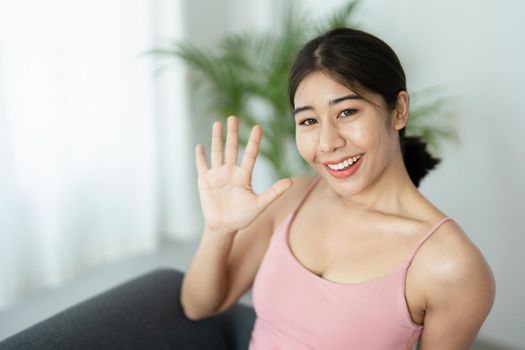 stress relief, muscle relaxation, breathing exercises, exercise, meditation, portrait of Young Asian woman relaxing her body from office work by practicing yoga by watching online tutorials