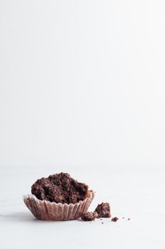 Started chocolate muffin on a white background copy space