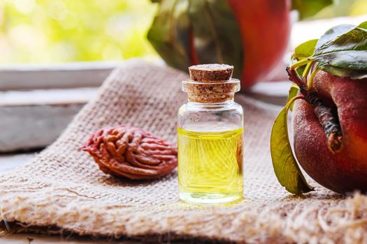 Peach seed oil in a bottle. Selective focus.food