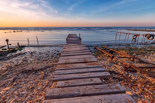 old wooden pier at the fishing harbor. Horizontal view