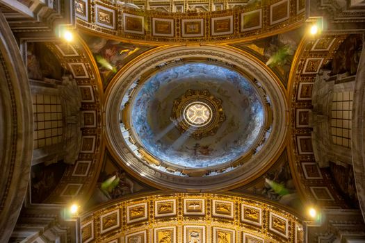 Vatican, Italy - June 13, 2017: Dome Interior of Saint Peter Basilica. Saint Peter's Basilica has the largest interior of any Christian church in the world.