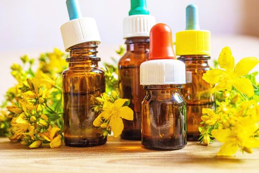 extract St. John's wort in a small jar. Selective focus.nature