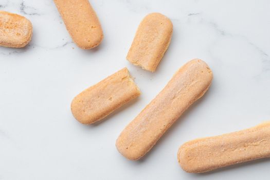 Italian cookie savoiardi. Sweet biscuits. Sponge cookies tiramisu isolated on white background. Copy Space