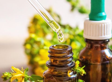 extract St. John's wort in a small jar. Selective focus.nature