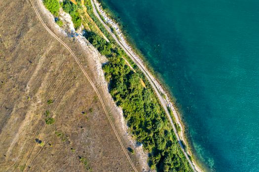 Beauty sea and steep coastline surface aerial top view from the drone.