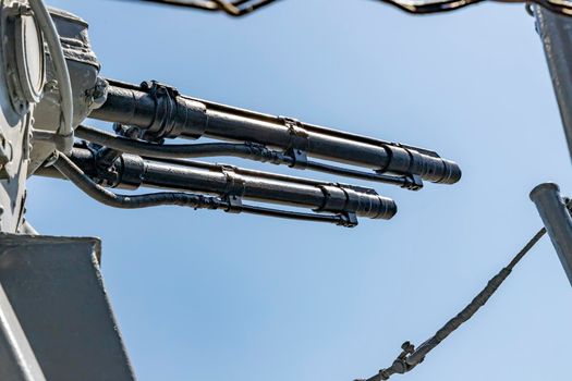 Close-up of a tower with a ship gun. Ship weapon tower. Naval exercises, attack, and defense.