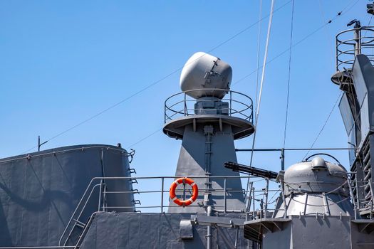 A part of the modern military navy ship. Military sea landscape with clear sky